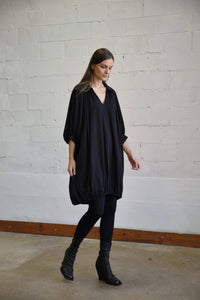 Elegant Poetry Dress by SIMPLY MILA, showcasing a stylish modern women's dress with a flowy silhouette and intricate fabric details.