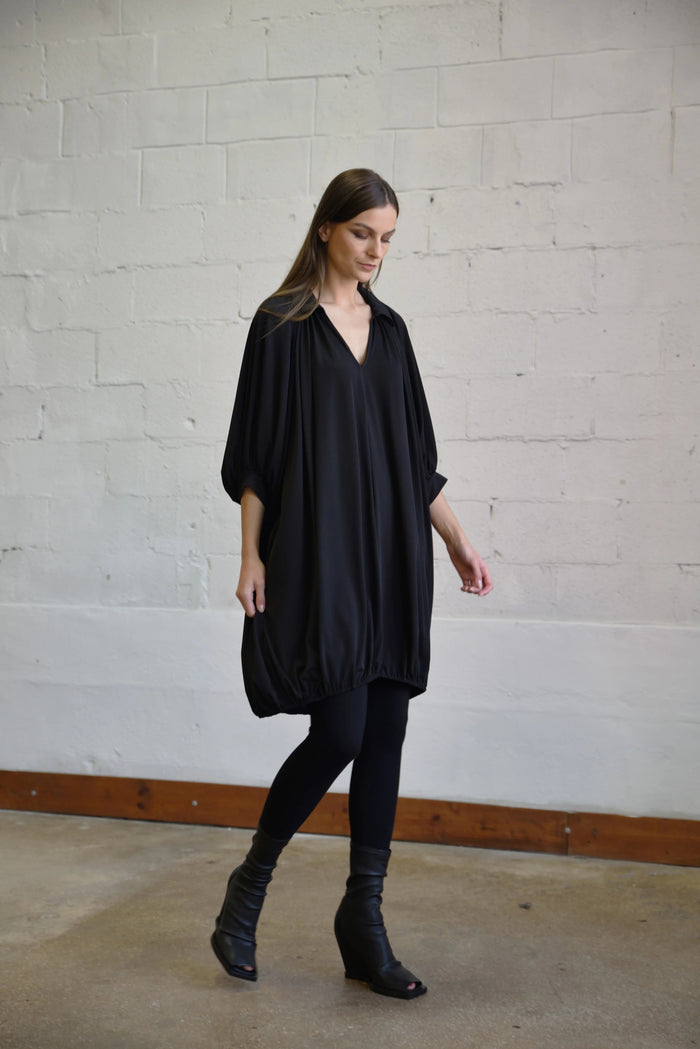 Elegant Poetry Dress by SIMPLY MILA, showcasing a stylish modern women's dress with a flowy silhouette and intricate fabric details.