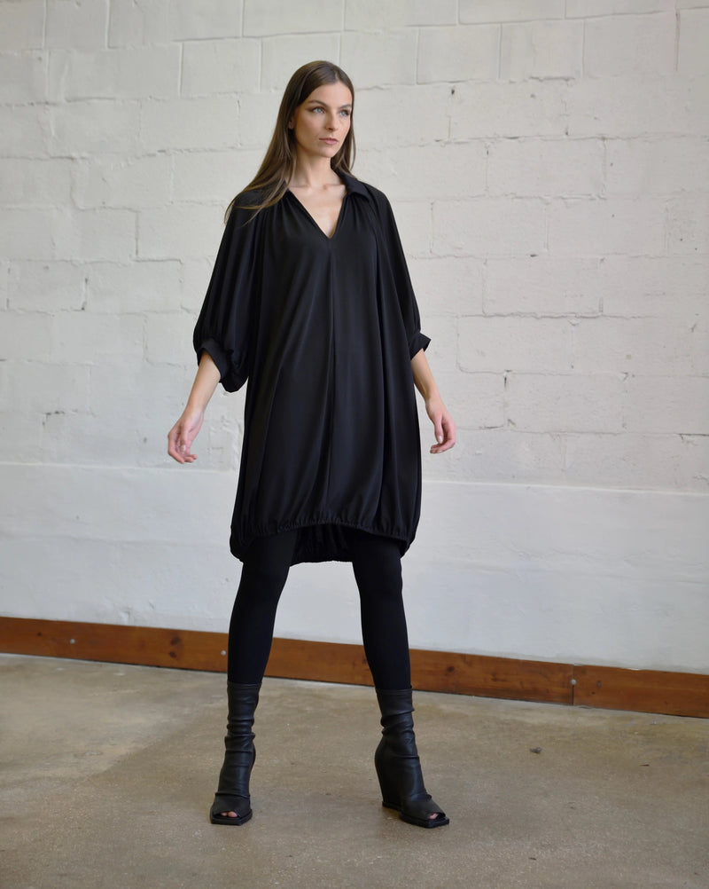 Elegant Poetry Dress by SIMPLY MILA, modern women's dress with stylish design and comfortable fit, shown in an outdoor setting.