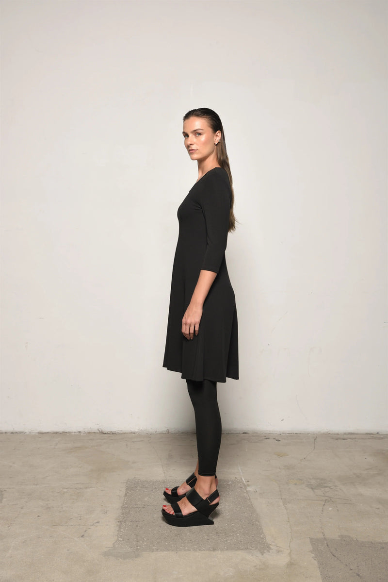 Simply Mila Traveler Dress, a stylish women's dress with a comfortable fit, shown in a natural pose on a plain background.