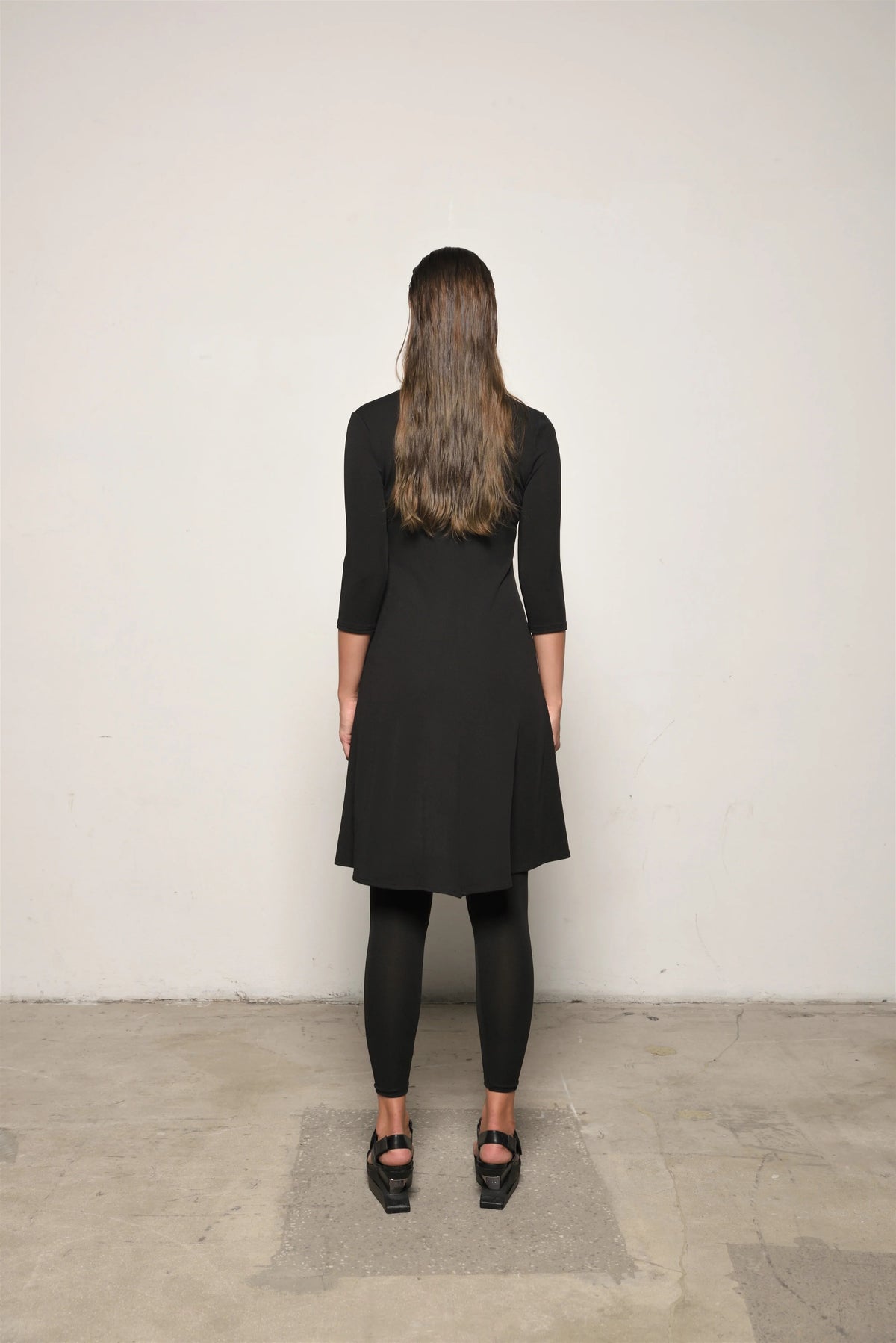 Elegant traveler dress by SIMPLY MILA, featuring flowing fabric and stylish design, perfect for modern women's casual or travel wear.