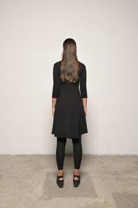 Elegant traveler dress by SIMPLY MILA, featuring flowing fabric and stylish design, perfect for modern women's casual or travel wear.