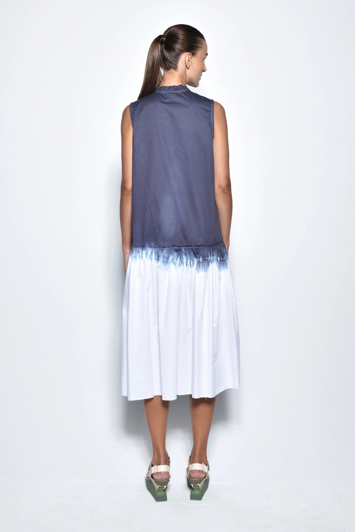 Back view of SIMPLY MILA Ombre Sahara dress showing flowing fabric and stylish design in a modern women's dress.