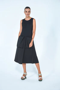 Black Big Pocket dress from SIMPLY MILA Modern Women's Clothing, shown on a model, featuring a relaxed fit and prominent front pockets.