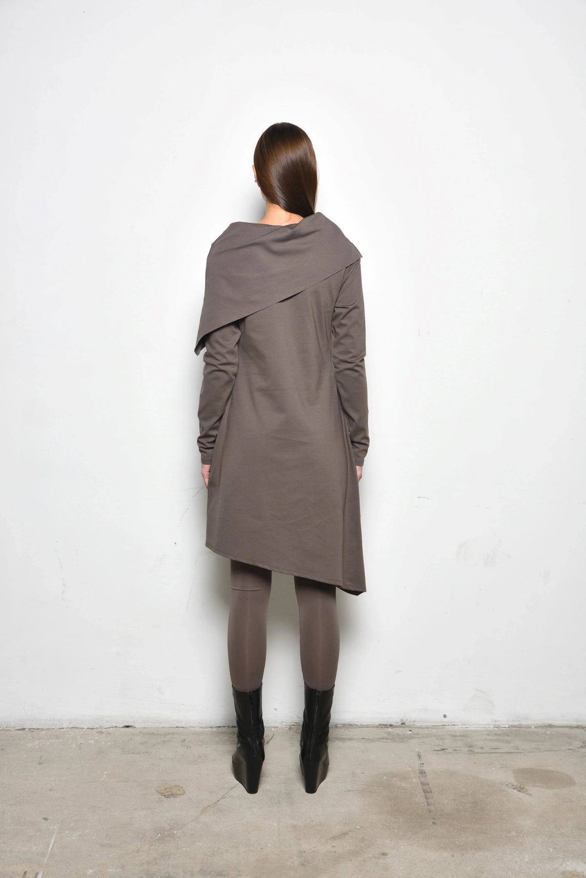 Back view of a stylish Amsterdam dress by SIMPLY MILA Modern Women's Clothing, featuring a flowing design and elegant fabric.