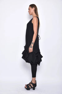 Side view of a stylish Aura dress by SIMPLY MILA Modern Women's Clothing, showcasing its elegant design and fabric details.