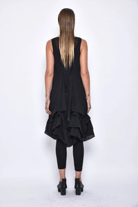Back view of a stylish Aura dress by SIMPLY MILA Modern Women's Clothing, featuring a flowing design and elegant fit.