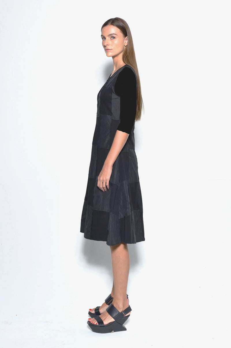 Side view of a stylish Chessboard dress by SIMPLY MILA Modern Women's Clothing, featuring a black and white checkered pattern.