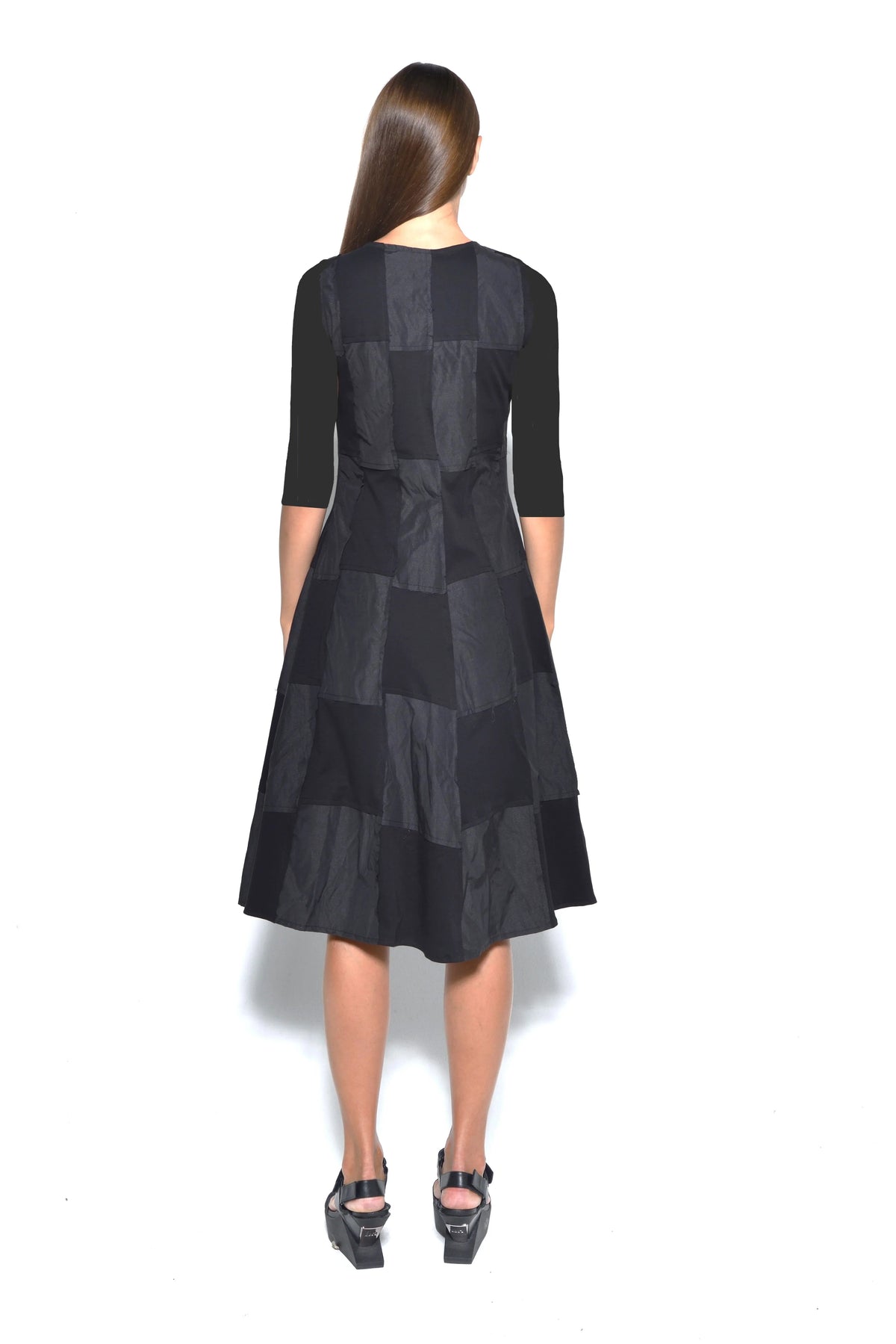 Back view of a SIMPLY MILA modern women's chessboard dress with a black and white checkered pattern.