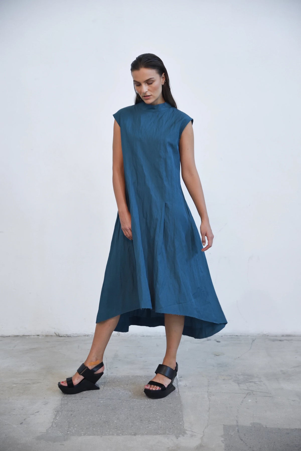 Black Gaia dress from SIMPLY MILA Modern Women's Clothing, featuring a stylish, flowy design with elegant details.