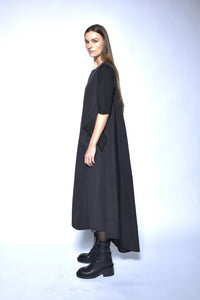 Elegant high-low dress by SIMPLY MILA, showcasing a flowing design with a fitted bodice and layered skirt for modern women's fashion.