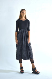 Hydra dress by SIMPLY MILA Modern Women's Clothing, stylish sleeveless dress in soft fabric, displayed on a hanger.