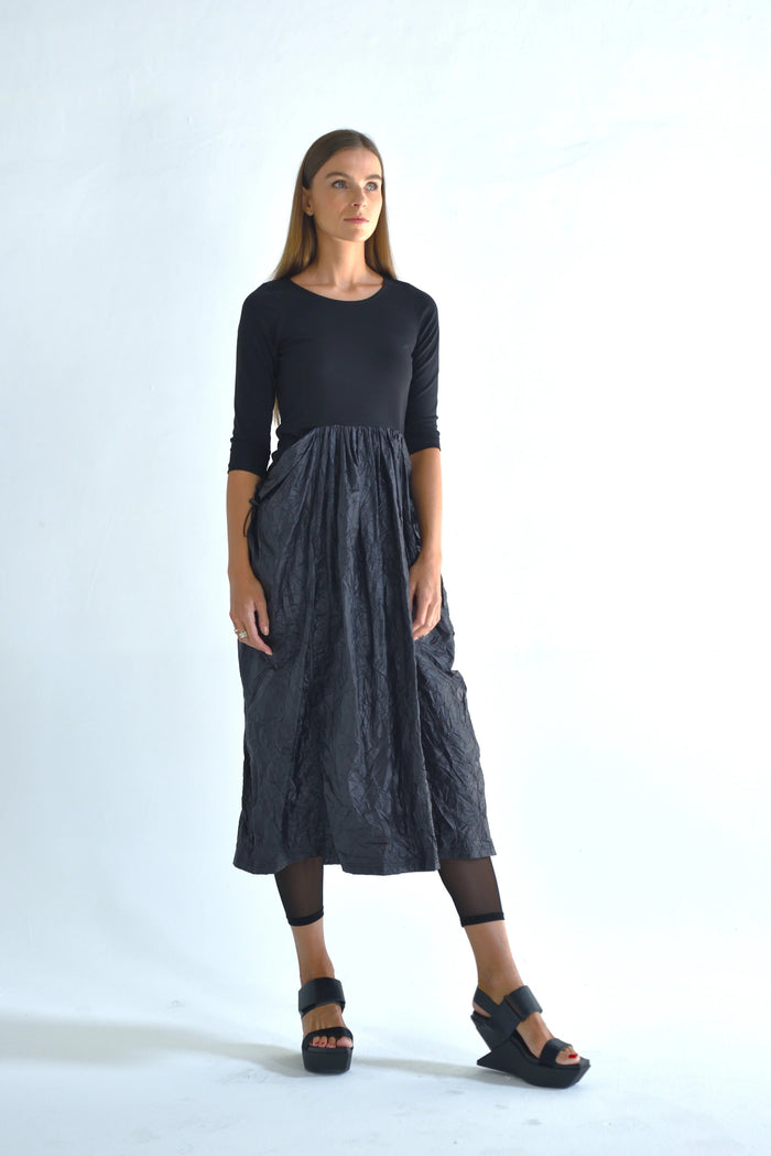 Hydra dress by SIMPLY MILA Modern Women's Clothing, stylish sleeveless dress in soft fabric, displayed on a hanger.