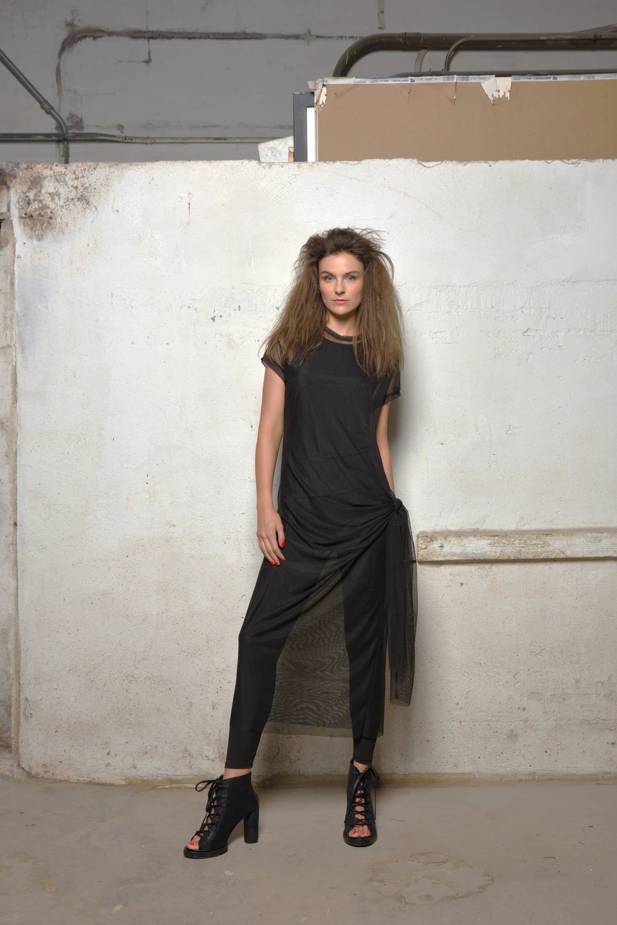 Black mesh dress from SIMPLY MILA Modern Women's Clothing, featuring sheer fabric and stylish design for women.