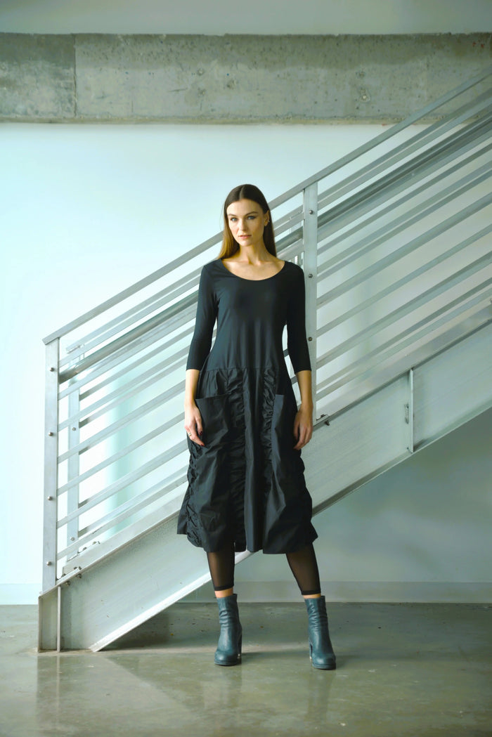 Elegant Ophelia dress from SIMPLY MILA Modern Women's Clothing, featuring a flowing design and stylish details.