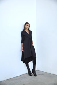 Sasha Dress by SIMPLY MILA Modern Women's Clothing, stylish dress displayed on a hanger with a neutral background.