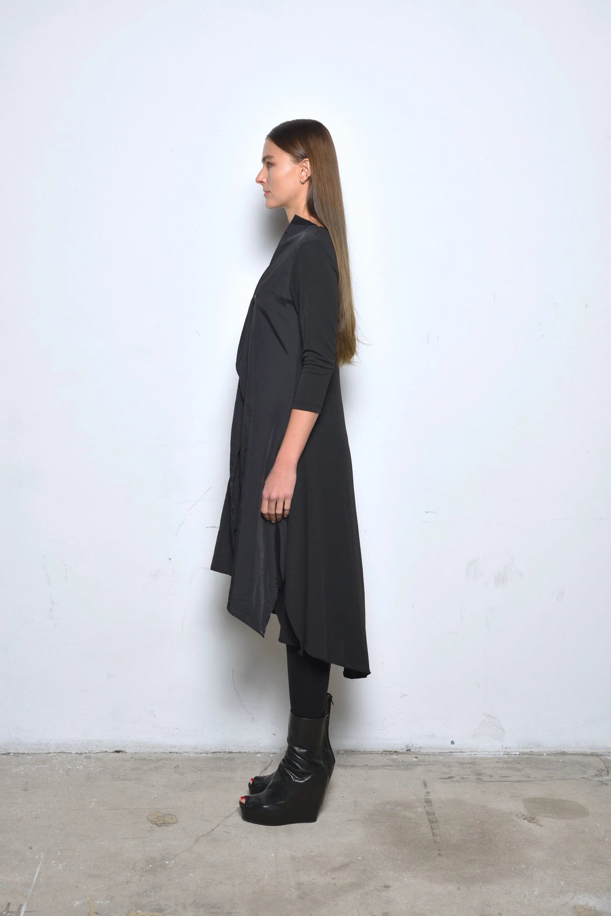 Side view of the Sasha dress by SIMPLY MILA, a modern women's dress with a stylish, elegant silhouette and soft fabric.