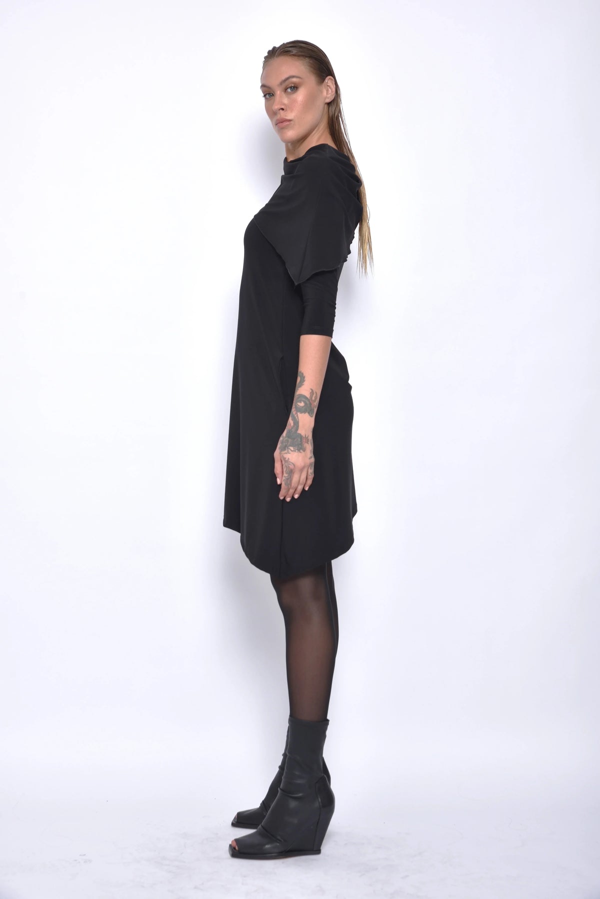 Side view of the Selene dress by SIMPLY MILA Modern Women's Clothing, showcasing its elegant design and fabric details.