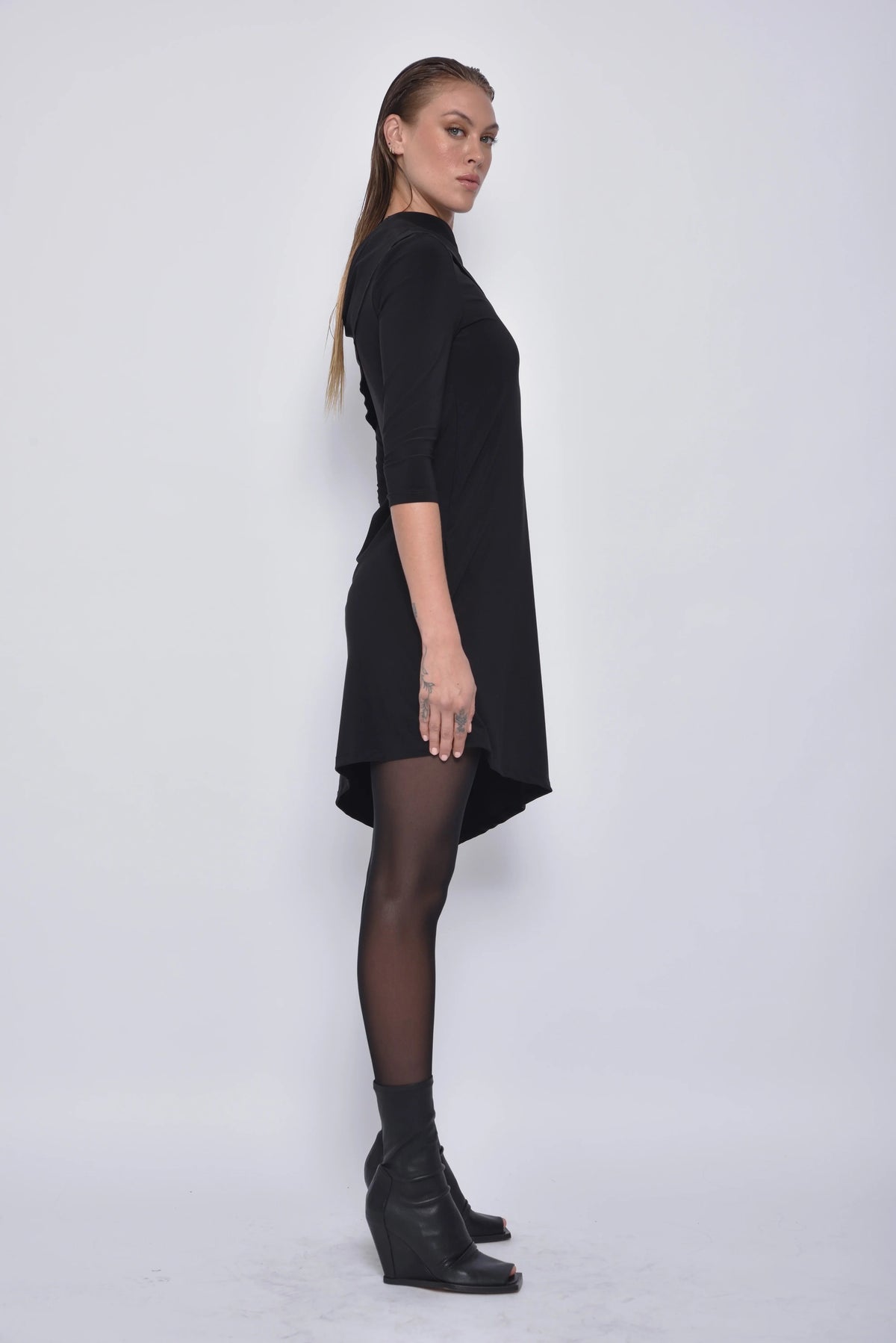 Side view of the Selene dress by SIMPLY MILA, a modern women's dress with a stylish fit and elegant design.