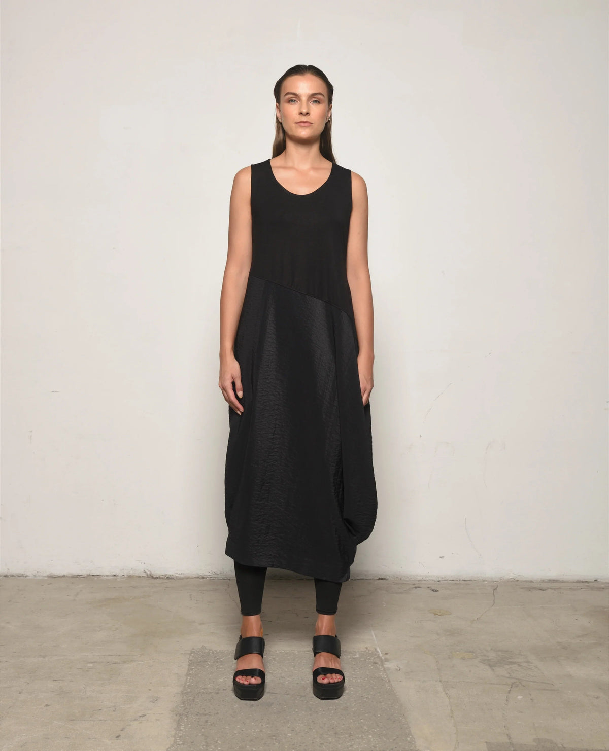 Sleeveless Babylon dress by SIMPLY MILA Modern Women's Clothing, showcasing a stylish, flowy dress with a fitted bodice and elegant design.