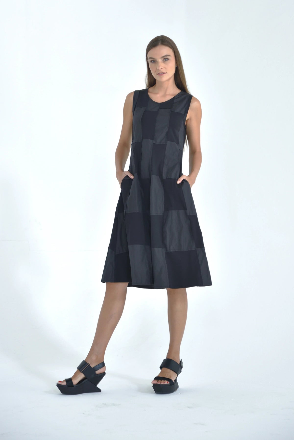 Sleeveless chessboard dress by SIMPLY MILA Modern Women's Clothing, featuring a stylish black and white checkered pattern.