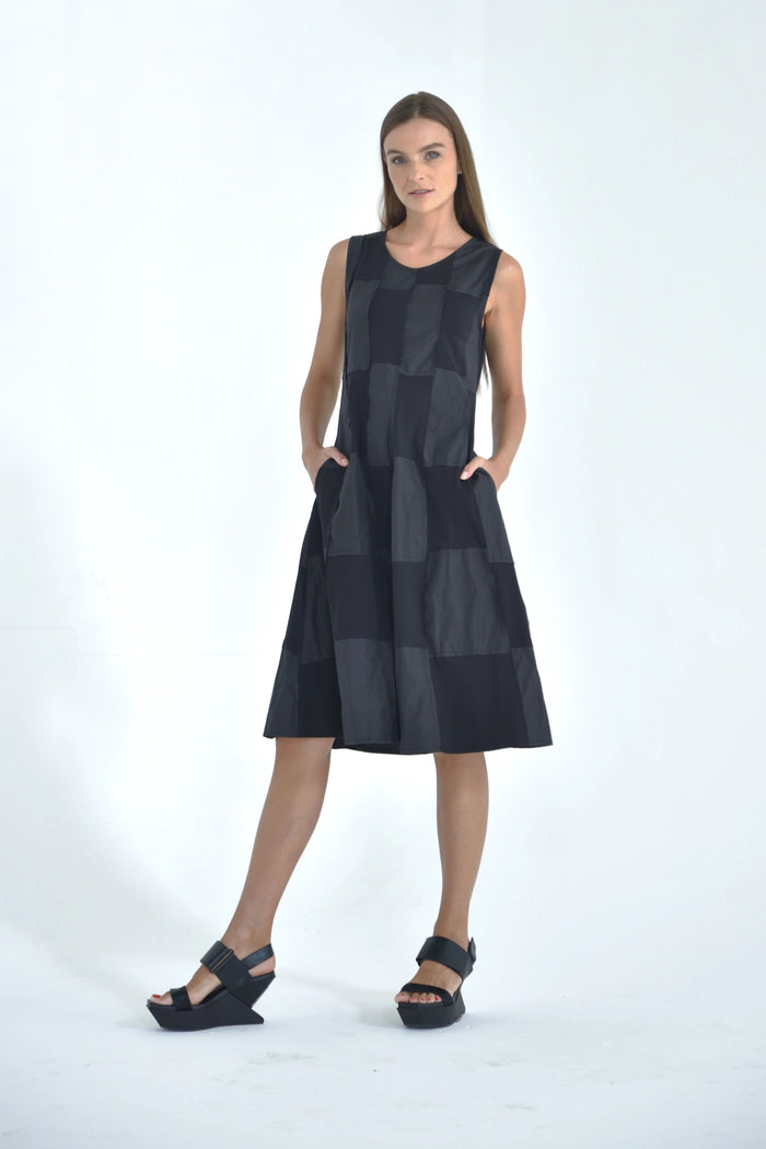 Sleeveless chessboard dress by SIMPLY MILA Modern Women's Clothing, featuring a stylish black and white checkered pattern.