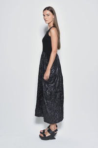 Side view of a sleeveless Hydra dress by SIMPLY MILA, featuring a modern design in lightweight fabric.