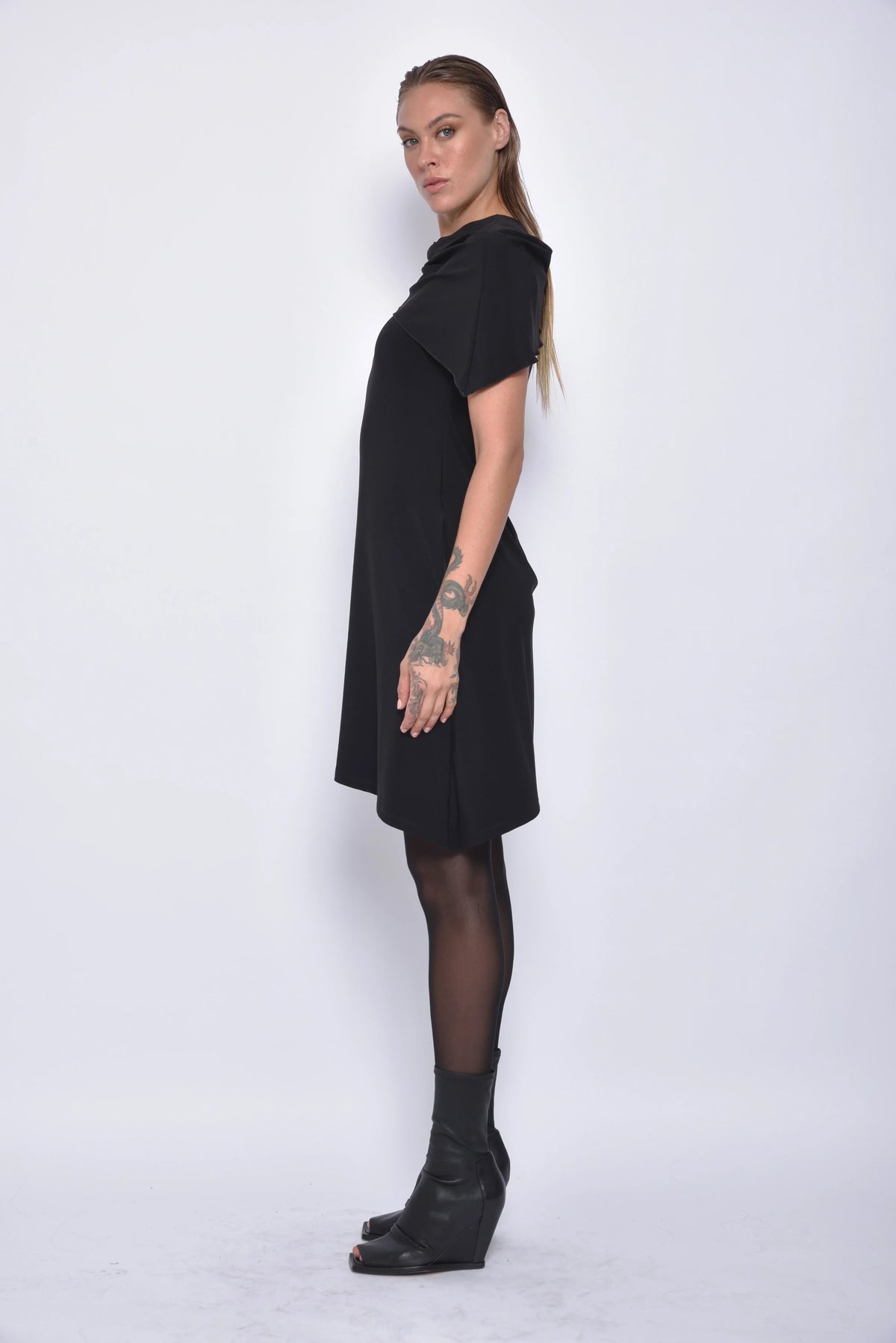 Side view of a sleeveless Selene dress by SIMPLY MILA Modern Women's Clothing, featuring a sleek design and lightweight fabric.