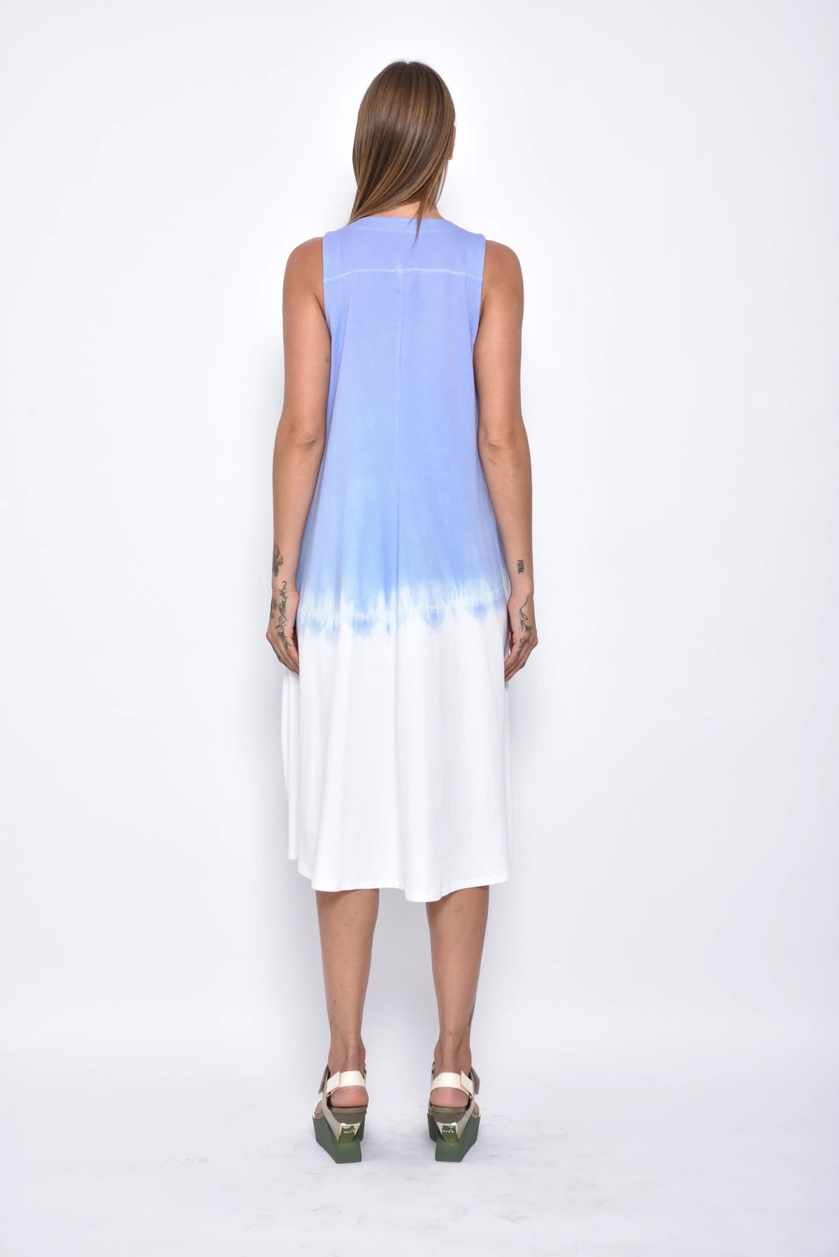 Back view of the Maia Ombre dress by SIMPLY MILA Modern Women's Clothing, featuring a flowing design with a gradient ombre pattern.