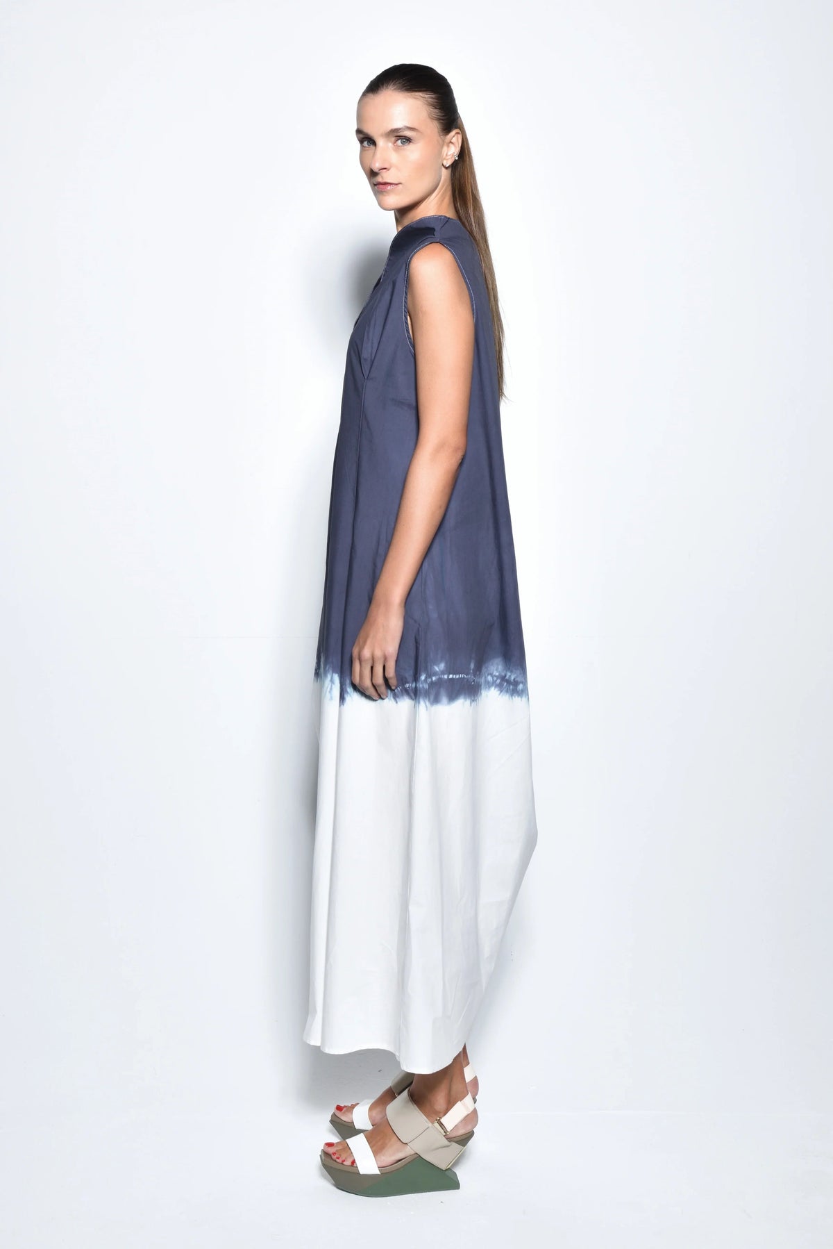 Side view of a SIMPLY MILA Ombre Imperial dress, a stylish women's dress with a flowing silhouette and gradient color design.
