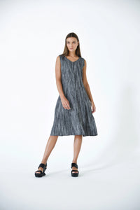 SIMPLY MILA Lisbon Dress displayed on a hanger, featuring a stylish, modern women's dress with a flowing design and vibrant color.