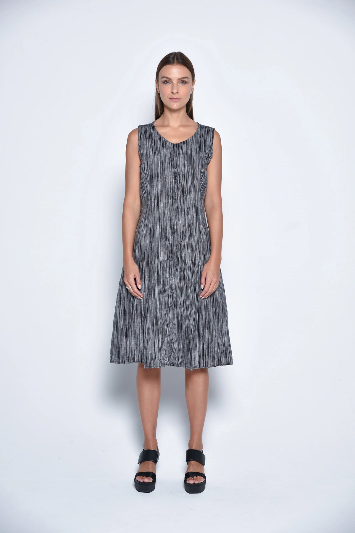 Front view of the Lisbon Dress by SIMPLY MILA, a stylish women's dress with a fitted bodice and flowing skirt.