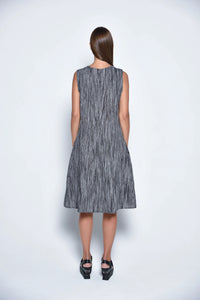 Back view of the SIMPLY MILA Lisbon Dress, a stylish women's dress with a flowing silhouette and modern design.