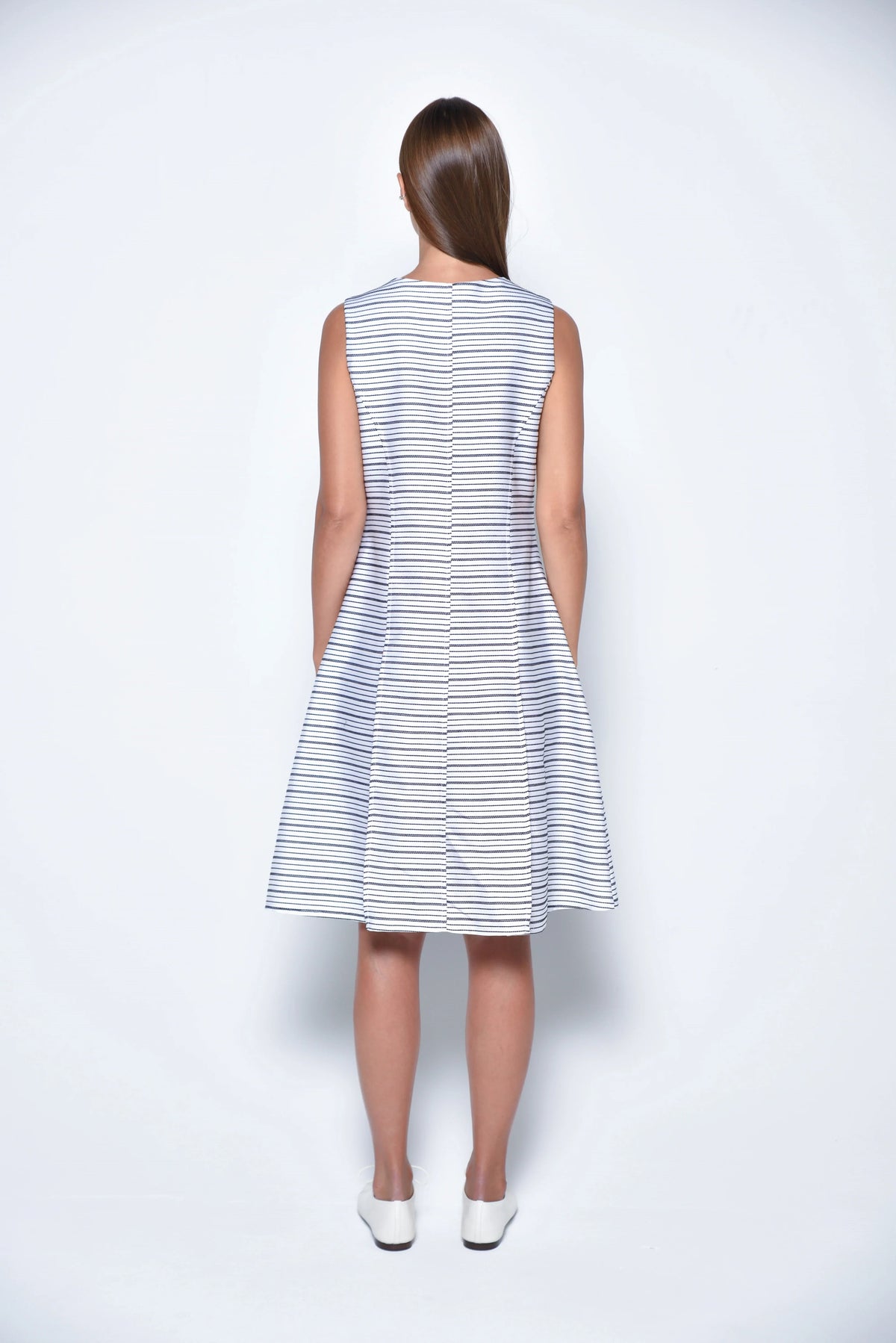Back view of a stylish Lisbon Dress by SIMPLY MILA, a modern women's dress with a flattering fit and elegant design.