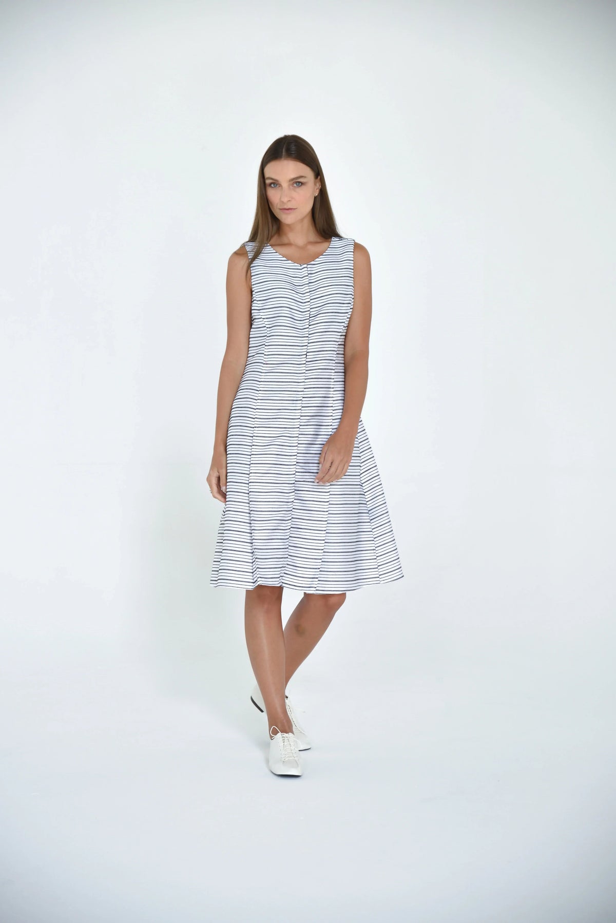 Elegant Lisbon dress by SIMPLY MILA, featuring a stylish modern women's dress with a flattering fit and vibrant design.