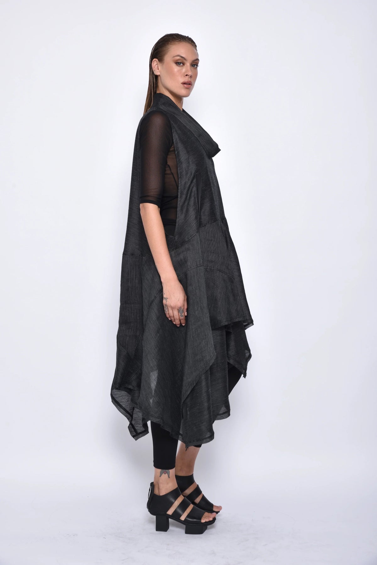 Simply Mila Juno dress, a stylish women's dress with a modern design, displayed on a hanger against a neutral background.