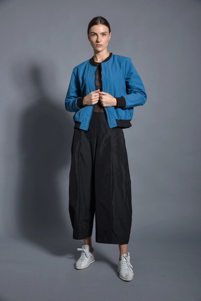 Simply Mila modern women's baseball jacket with classic design, featuring a button-front and ribbed collar.