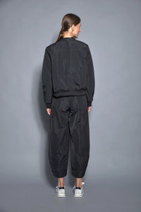 Modern women's baseball jacket by SIMPLY MILA, featuring a stylish design with ribbed cuffs and a snap front.