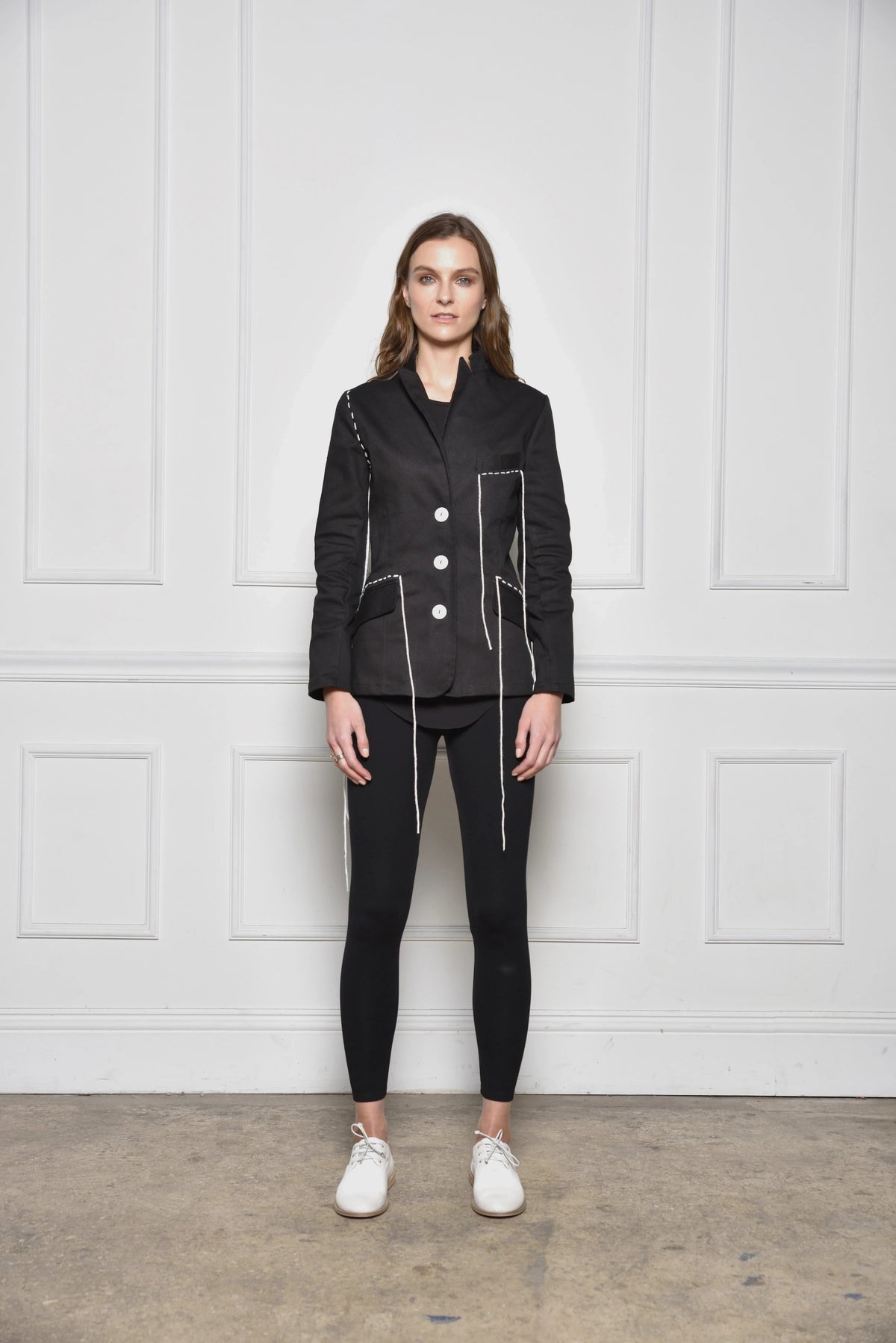 Simple black Baste Stitch jacket by SIMPLY MILA, modern women's clothing, featuring detailed stitching and tailored fit.
