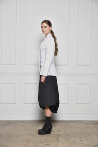 Simple modern women's Baste Stitch Jacket by SIMPLY MILA, featuring a stylish design and tailored fit, shown on a model.