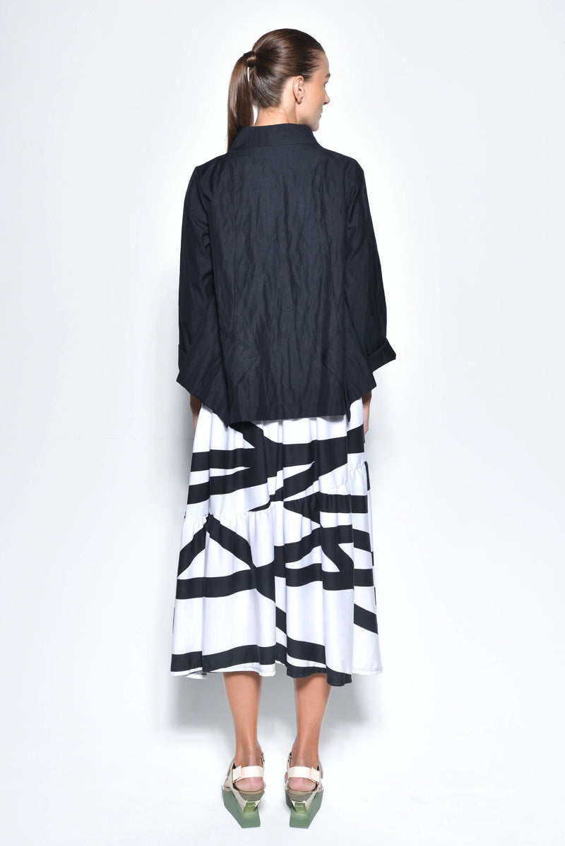 Black Tokyo jacket by SIMPLY MILA, modern women's outerwear with a stylish, tailored fit, displayed on a hanger.