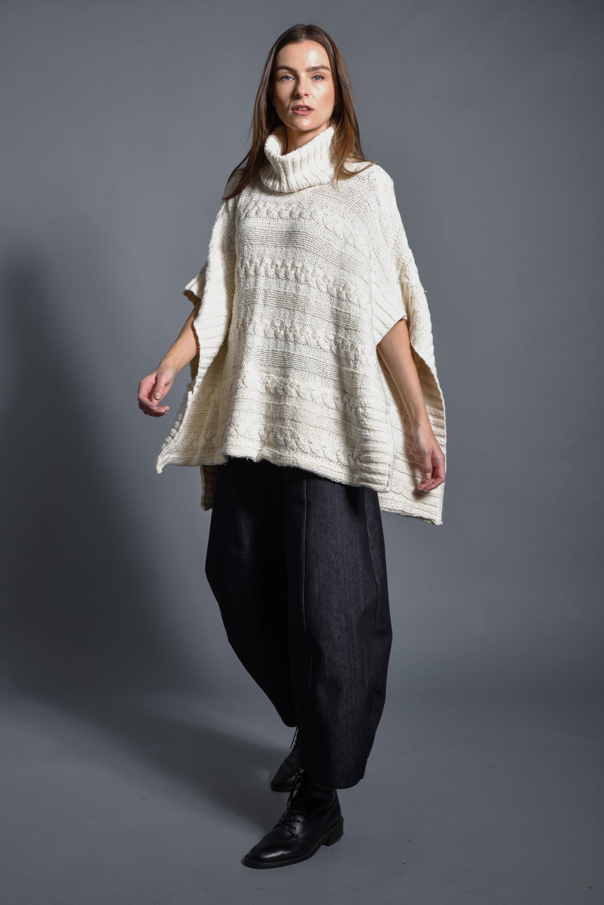 Modern women's Cable Poncho by SIMPLY MILA featuring a cozy, textured knit design perfect for stylish layering.