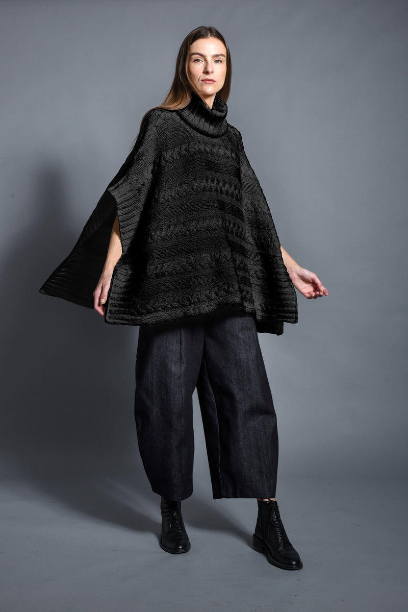 Black Cable Poncho by SIMPLY MILA, a cozy modern women's clothing accessory with cable knit texture.