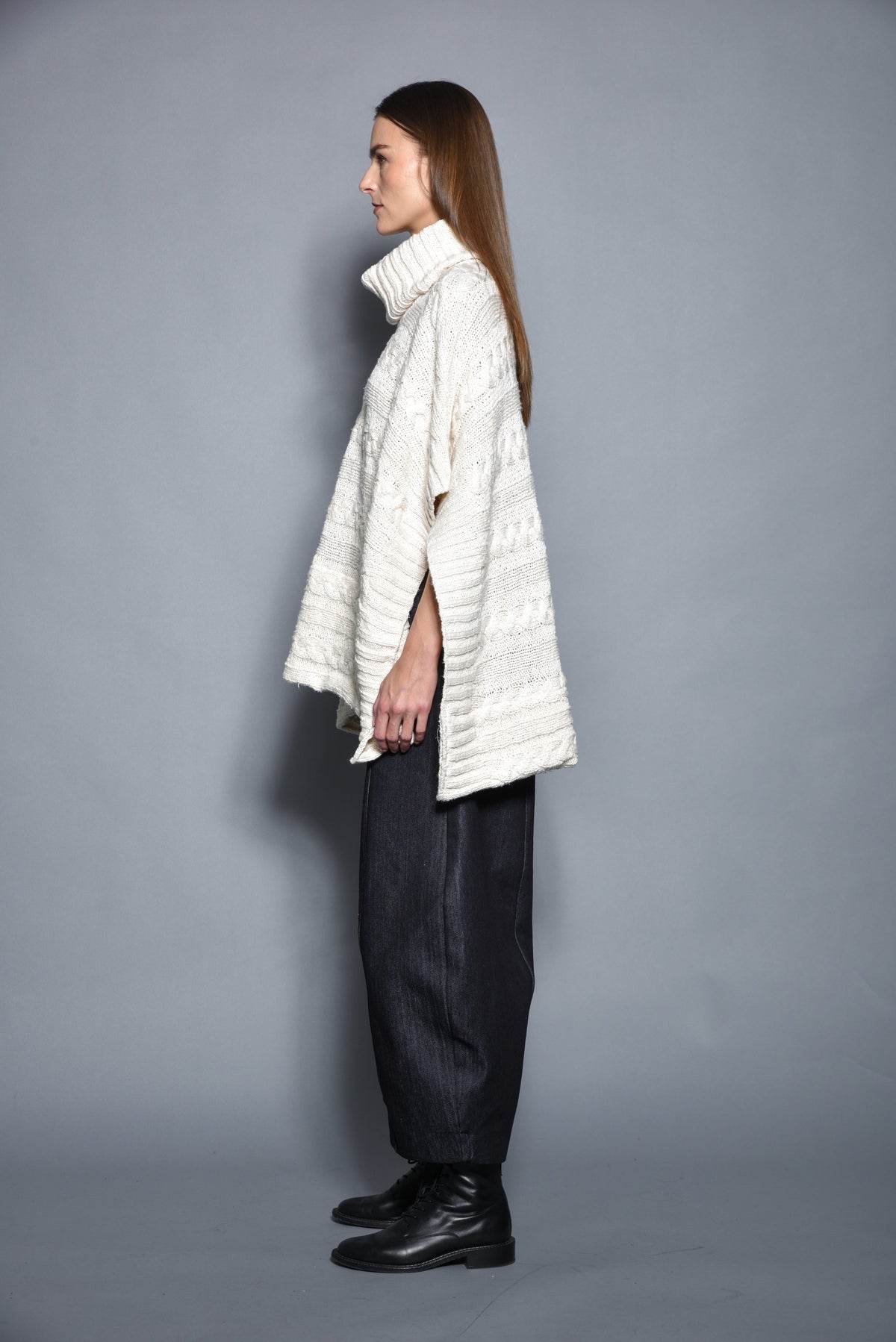 Gray Cable Poncho from SIMPLY MILA, a cozy modern women's clothing piece with a textured cable knit design.