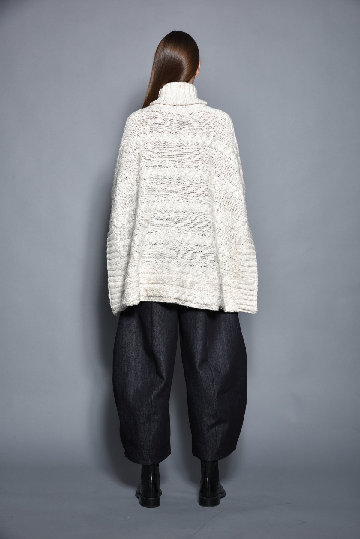 SIMPLY MILA Cable Poncho for women, cozy knit garment with cable pattern, stylish modern women's clothing for fall and winter wear.