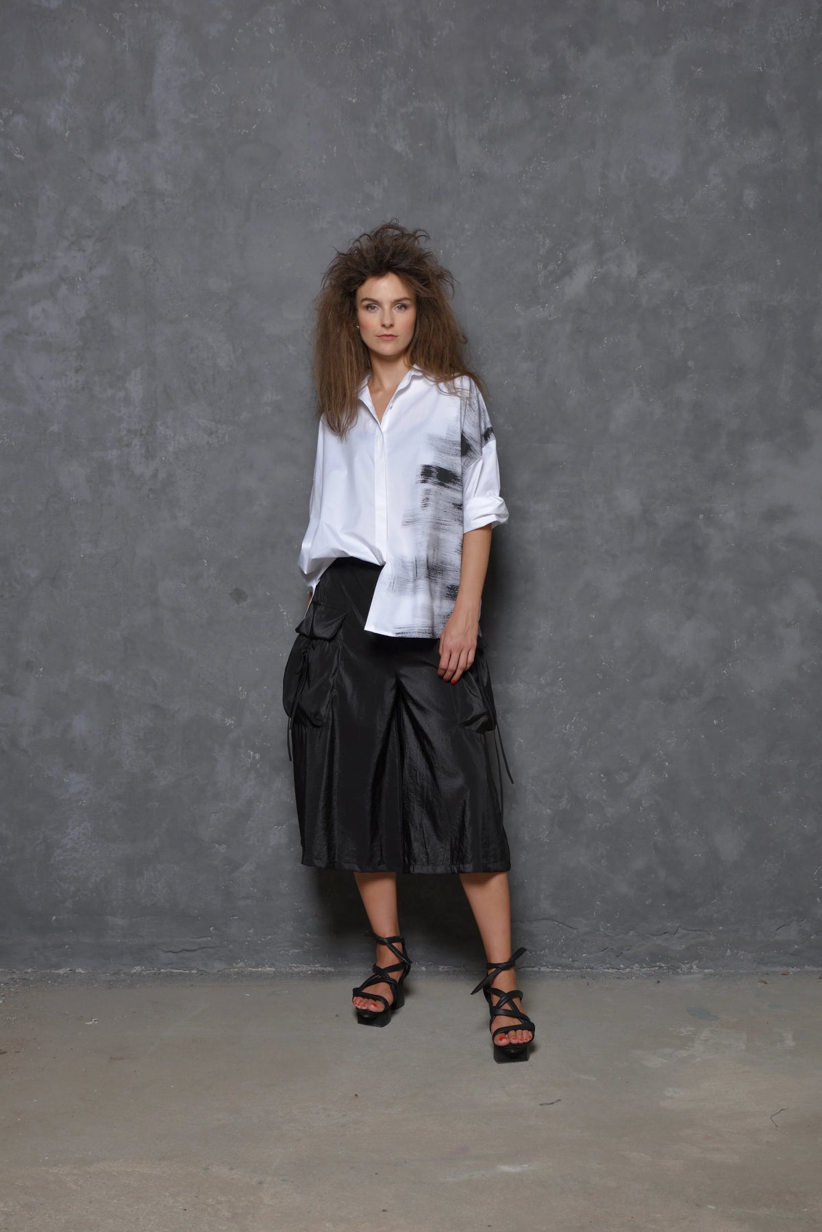 Light gray Stroke Boxy Shirt by SIMPLY MILA, featuring a loose fit and modern design, displayed on a hanger.