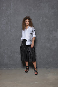 Light gray Stroke Boxy Shirt by SIMPLY MILA, featuring a loose fit and modern design, displayed on a hanger.