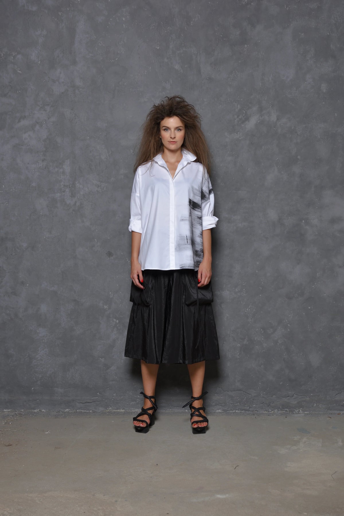 Front view of a Stroke Boxy Shirt by SIMPLY MILA, featuring a modern women's shirt with a relaxed fit and clean design.