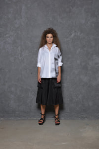 Front view of a Stroke Boxy Shirt by SIMPLY MILA, featuring a modern women's shirt with a relaxed fit and clean design.