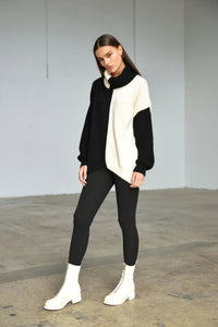 Simply Mila Ying Yan sweater, modern women's clothing, featuring soft knit fabric and stylish design in a close-up view.